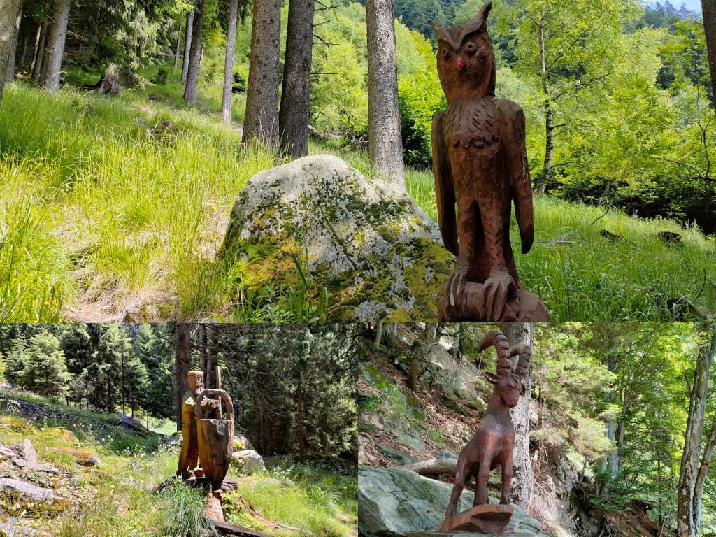 Alcune delle sculture in legno lungo il sentiero